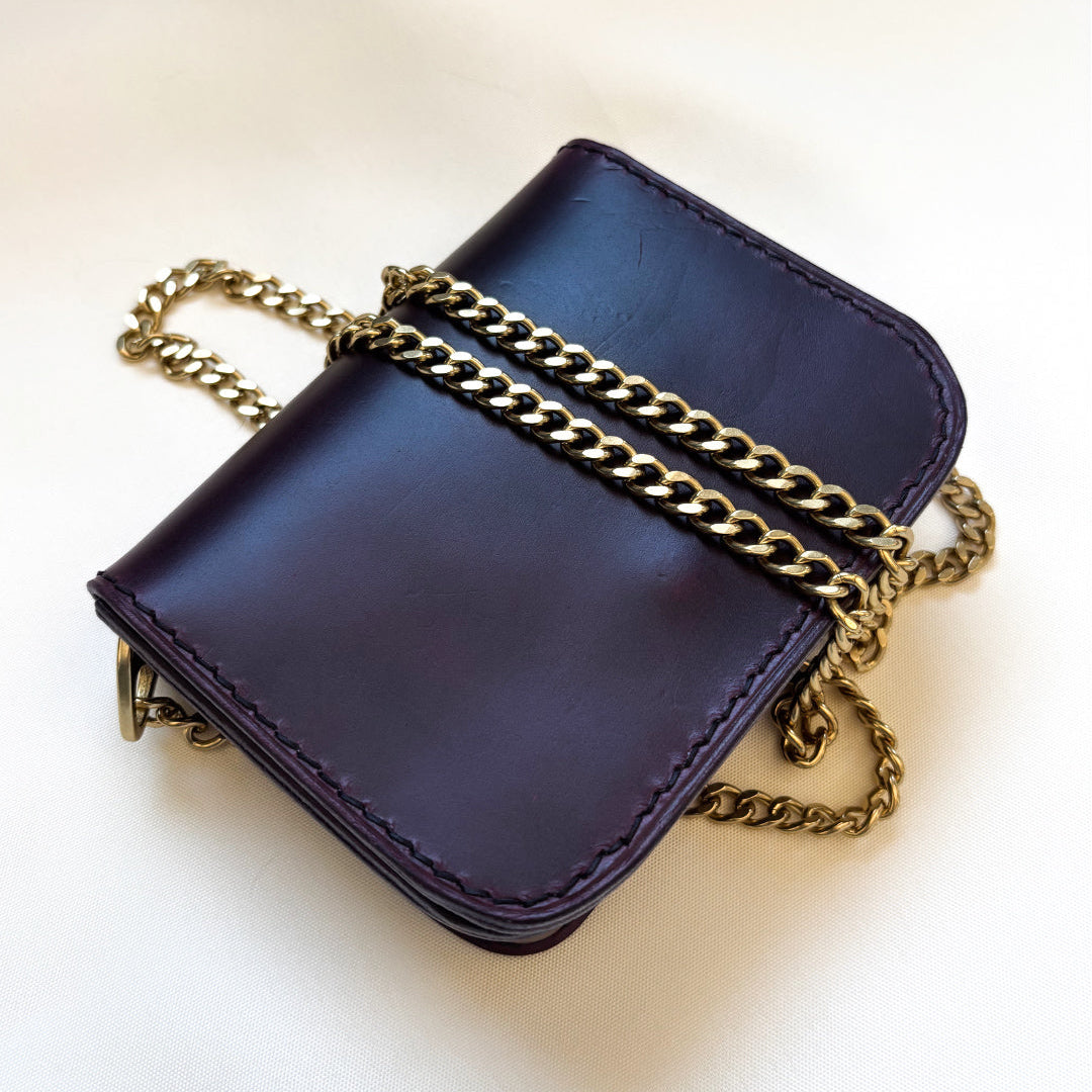 purple leather mini crossbody purse flat angle view