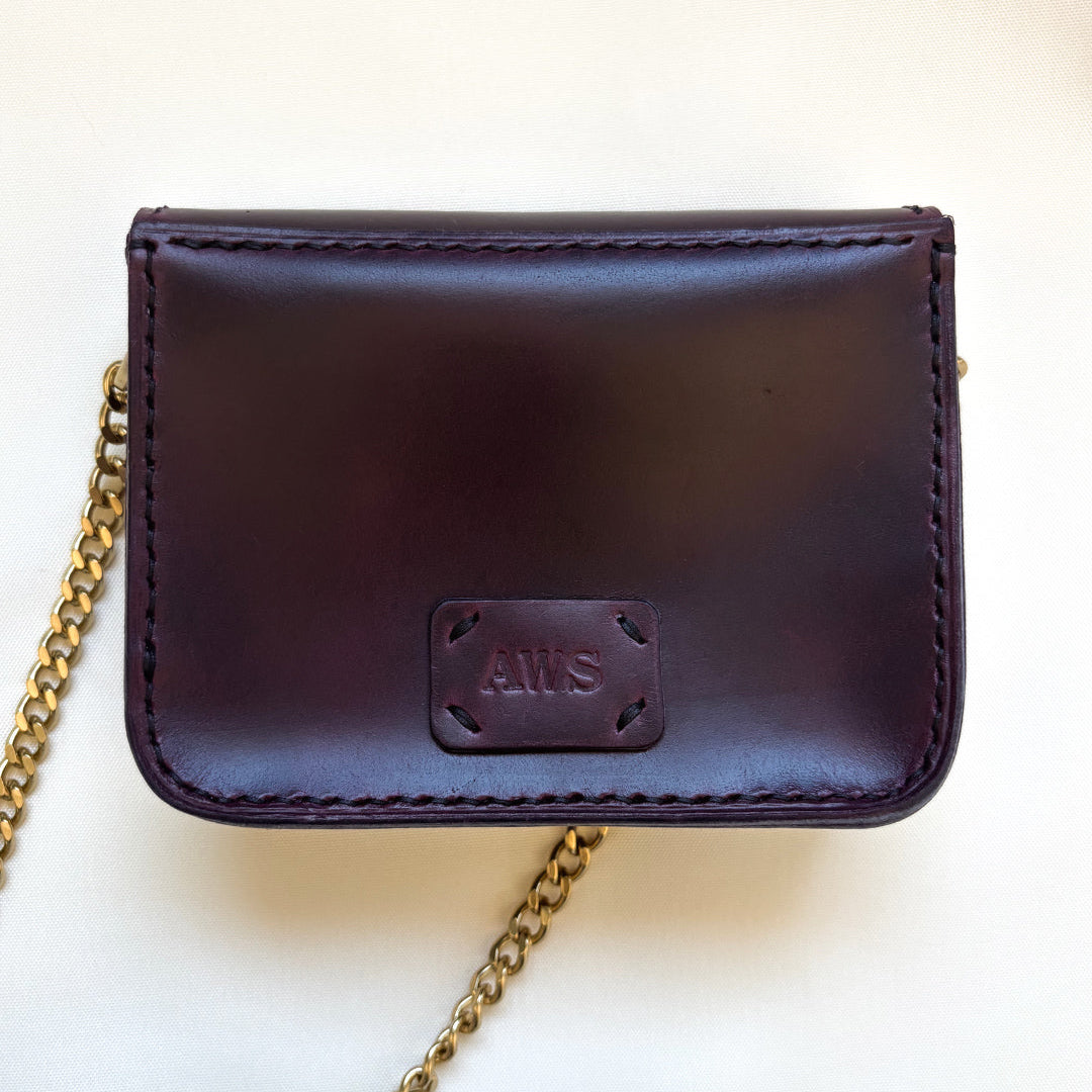 purple leather mini crossbody purse back view