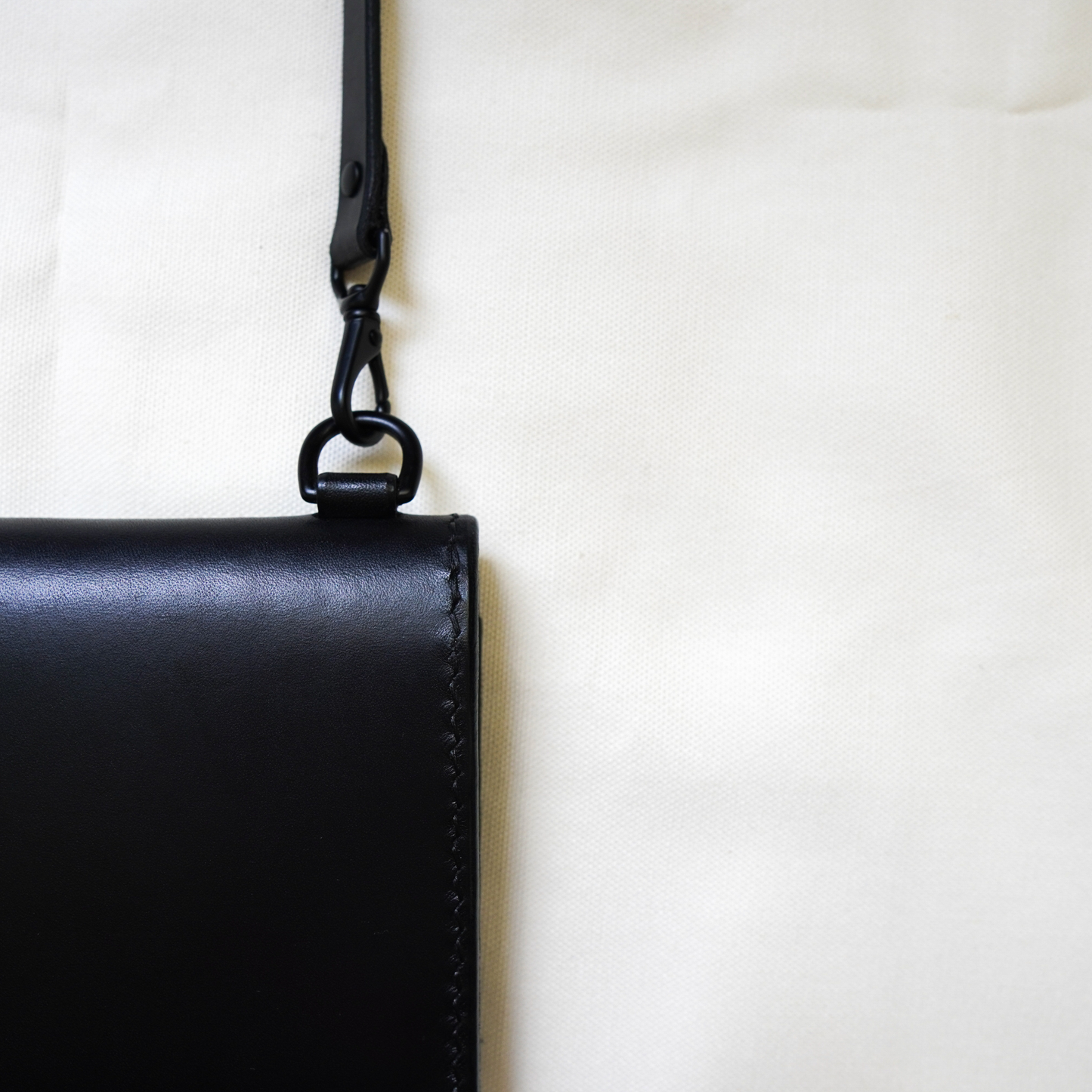 matte black leather crossbody wallet hardware