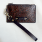 small tooled brown leather wristlet with zipper